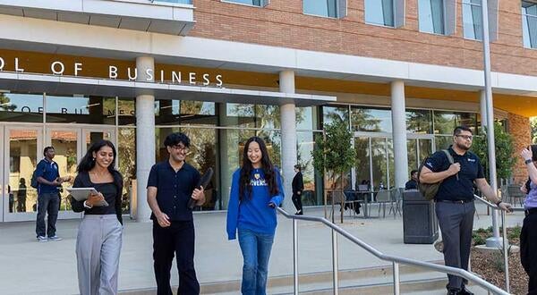 New School of Business building with students on front terrace