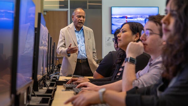 Professor Instructing Students in the New Business Building Computer Lab