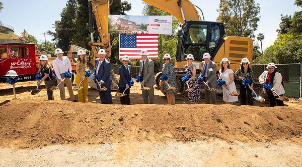 Campus leaders and the project team take their turn shoveling dirt at the goundbreaking ceremony