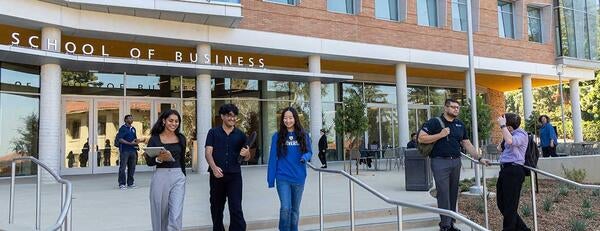 New School of Business building with students on front terrace