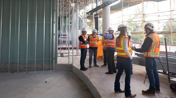 Faculty exploring New Building at Capping Ceremony